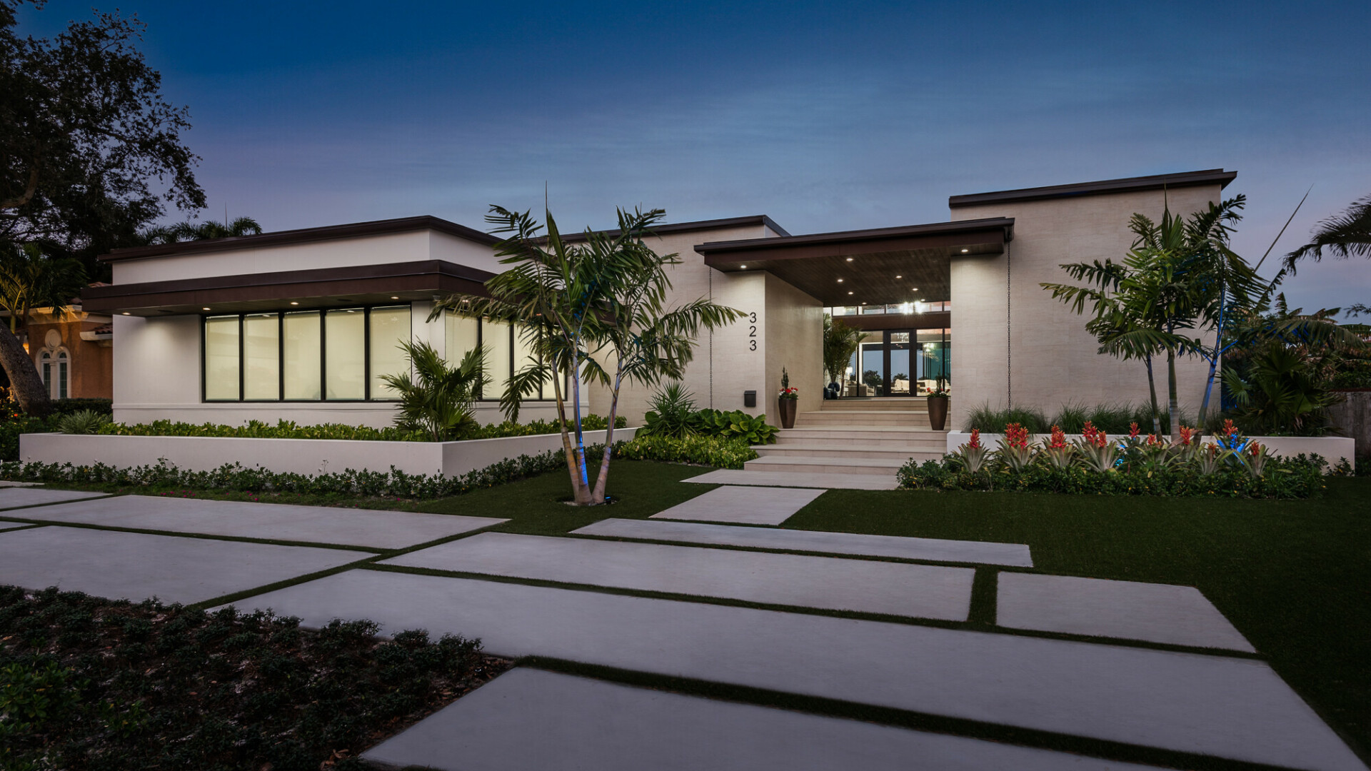 Front view of modern luxury home with a detailed walkway, Tampa FL