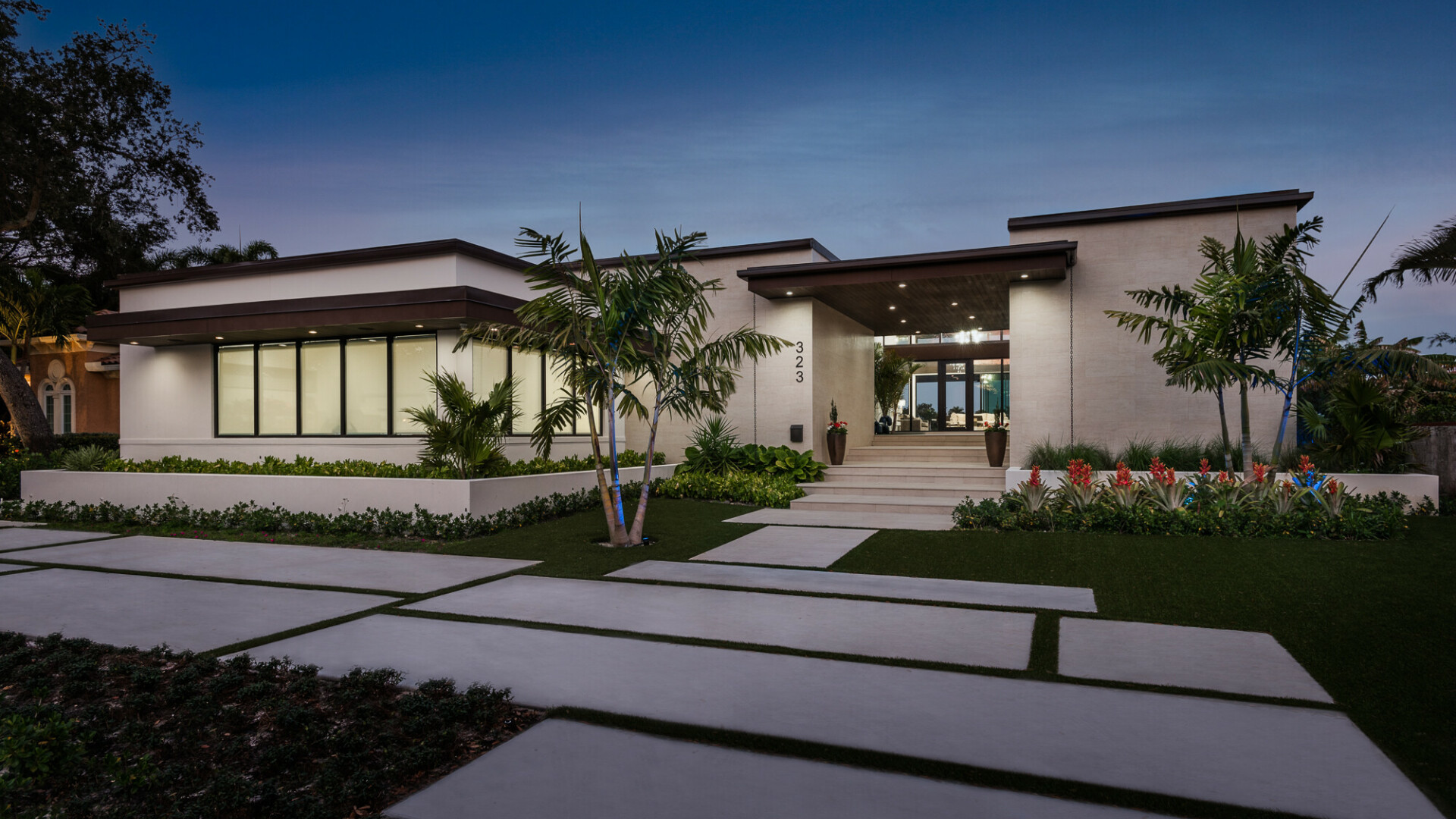 Front view of modern luxury home with a detailed walkway, Tampa FL
