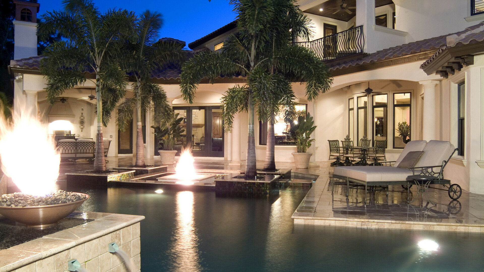 Luxury home featuring a large pool, firepit, a fireplace, and a custom outdoor kitchen, Tampa Bay FL