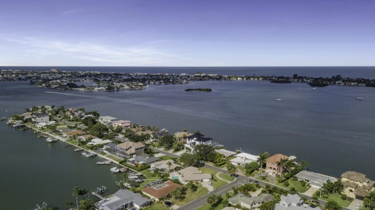 Tampa Bay real estate market: aerial view of waterfront homes on a canal-lined peninsula along the bay