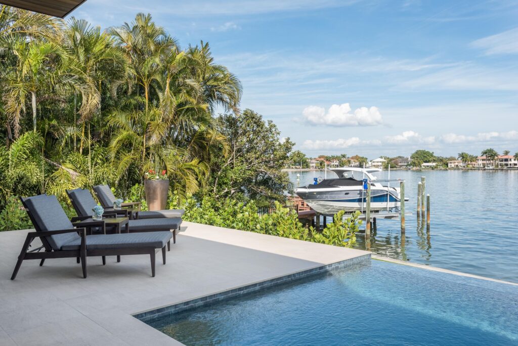 Waterfront pool deck and private dock at The Floridova in Tampa Bay
